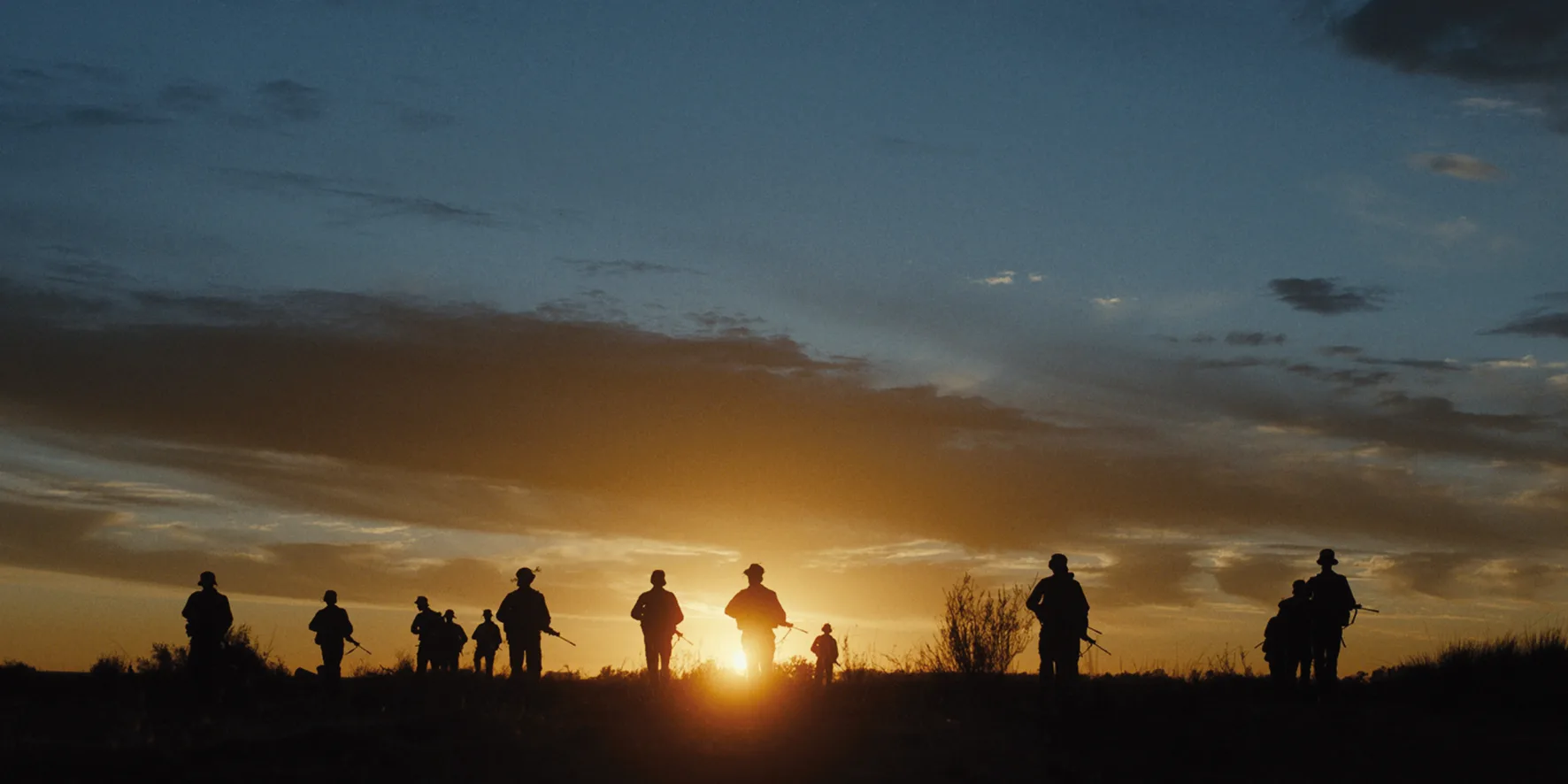 Moffie — soldiers silhouetted against the sunset on the Angolan border