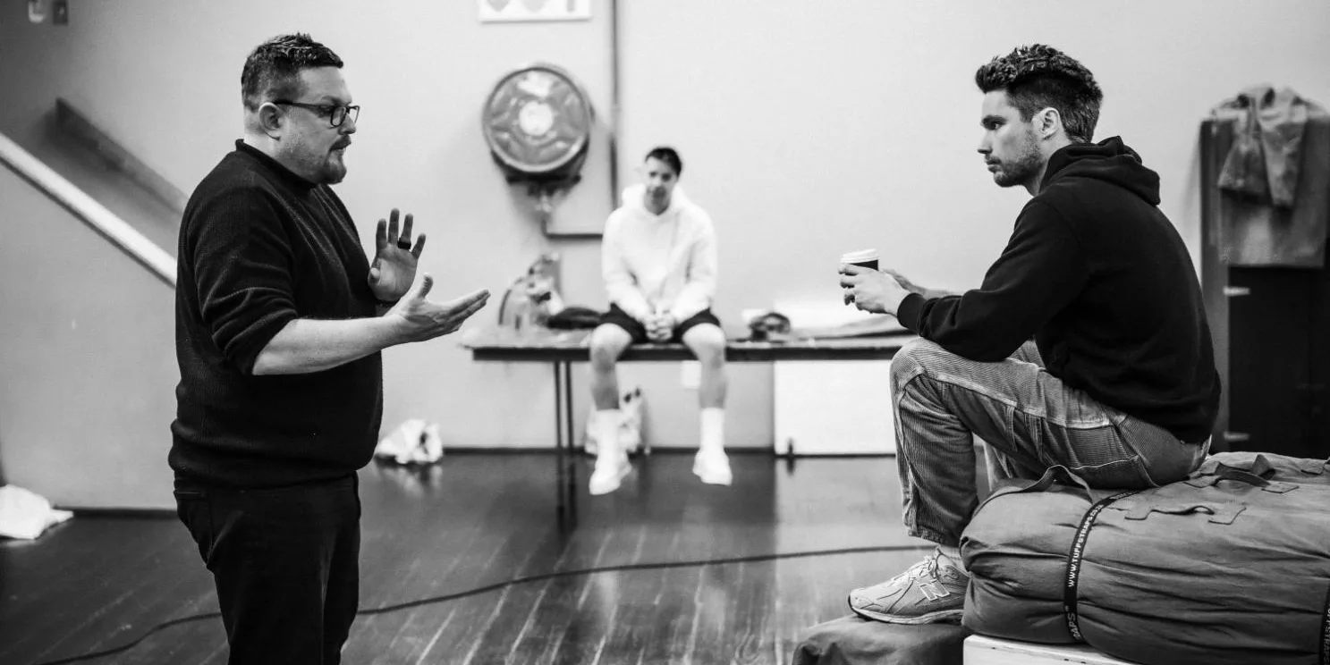Moffie (Play) — the director in rehearsal with two actors