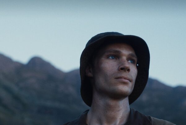 Moffie — Nicholas van der Swart in a bush hat against the mountains
